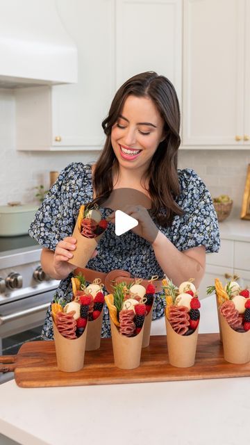 Carolina de Mauro on Instagram: "CHARCUTERIE CUPS ✨ your next party appetizer!  These cups are so cute and this is the easiest and most beautiful snack for your event. You can create them with whatever ingredients you prefer, but for ours we used:  - Trader Joe’s Fig & Olive Crackers - Salami - Babybel Cheese + Cherry Tomatoes - Trader Joe’s Peanut Butter Dark Chocolate Cups - Berries - Cheesesticks - Rosemary to decorate  Comment LINKS and I’ll DM the links to shop everything we used!  #founditonamazon #charcuterieboard #easyappetizers #appetizers #fallrecipes #entertainingathome #entertainingideas #entertaininginstyle #fallrecipe #bridalshowerideas #Itkhome #babyshoweridea #charcuteriecups #amazonfinds #amazonmusthaves #theeverygirlathome #snackboard #creativerecipes #pinterestinspired" Babybel Cheese Charcuterie, Make Your Own Charcuterie Cups, How To Make Charcuterie Cups, Christmas Charcuterie Cups Ideas, Fruit Charcuterie Cups, Make Ahead Charcuterie Cups, Food Board Ideas For Parties, Breakfast Charcuterie Cups, Charcuterie In A Cup