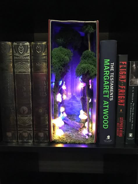 Illuminated mushroom forest book nook/insert. Hand made mushrooms from clay. Forest Book Nook, Book Nook Insert, Bookshelf Inserts, Book Nook Shelf, Book Nook Ideas, Nook Shelf, Forest Book, Bookshelf Art, Mushroom Forest