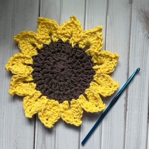 Sunflower Coaster Crochet Pattern - thecaffeinatedsnail.com Free Sunflower Coaster Crochet Pattern, Crocheted Sunflower Coasters, Sunflower Crochet Coasters Free Pattern, Crochet Sunflower Coasters, Crochet Sunflower Coasters Free Pattern, Sunflower Coasters Crochet Free Pattern, Crochet Sunflower Coaster Pattern, Sunflower Coaster Crochet, Crochet Sunflower Coaster