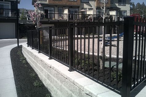 Custom Aluminum Fencing Retaining Wall | Sundeck Centre Retaining Wall With Fence On Top, Retaining Wall With Fence, Retaining Wall And Fence, Retaining Wall Fence, Patio Railing, Aluminum Fencing, Aluminum Fence, Backyard Remodel, Metal Fence