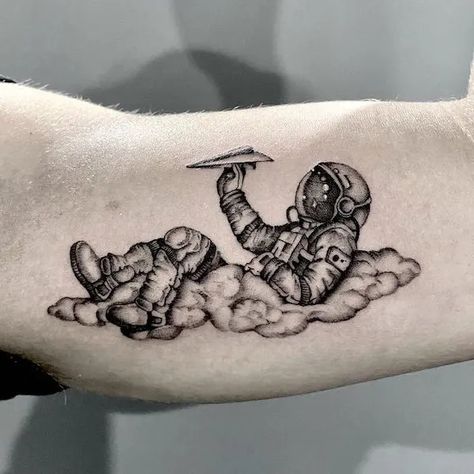 Astronaut Tattoo Ideas Astronaut Arm Tattoo, Galaxy Chest Tattoo Men, As Above So Below Tattoo Astronaut, Realistic Astronaut Tattoo, Funny Astronaut Tattoo, Tattoo Ideas For Men Space, Space Arm Tattoos For Women, Astronaut Sitting On Planet Tattoo, Astronaut In The Ocean Tattoo