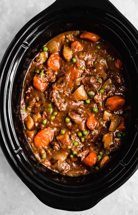 Mom's best ever slow cooker beef stew cooked to perfection with dry red wine, garlic, fresh herbs and tender potatoes and carrots. This easy beef stew recipe is just like the classic one you grew up with and makes a delicious, protein-packed dinner the whole family will love! #beefstew #slowcooker #slowcookerrecipe Stroganoff Crockpot, Stew Crockpot, Slow Cooker Recipes Beef Stew, Easy Beef Stew Recipe, Stew Beef, Stew Soup, Easy Beef Stew, Slow Cooker Recipes Beef, Homemade Beef Stew