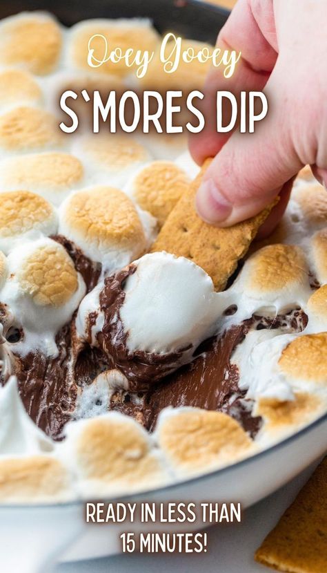 Close-up of a skillet filled with melted chocolate topped with toasted marshmallows and a graham cracker being dipped into it. Smores Dessert Dip, Smores Dip Recipe, Melted Chocolate Chips, Dessert Dip Recipes, Smores Dip, Skillet Desserts, Smores Dessert, Smore Recipes, Marshmallow Dip