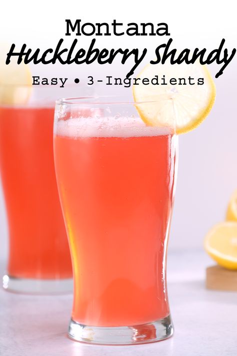 An easy 3-ingredient homemade Montana huckleberry shandy recipe perfect for a hot day. Sweet, tart, and oh-so-refreshing! #huckleberryshandy #huckleberrycocktail #montanacocktailrecipe Huckleberry Alcohol Drinks, Huckleberry Cocktails, Huckleberry Vodka Recipes, Shandy Drink, Huckleberry Lemonade, Colorado Recipes, Huckleberry Recipes, Lemon Drop Recipe, Tailgate Party Ideas