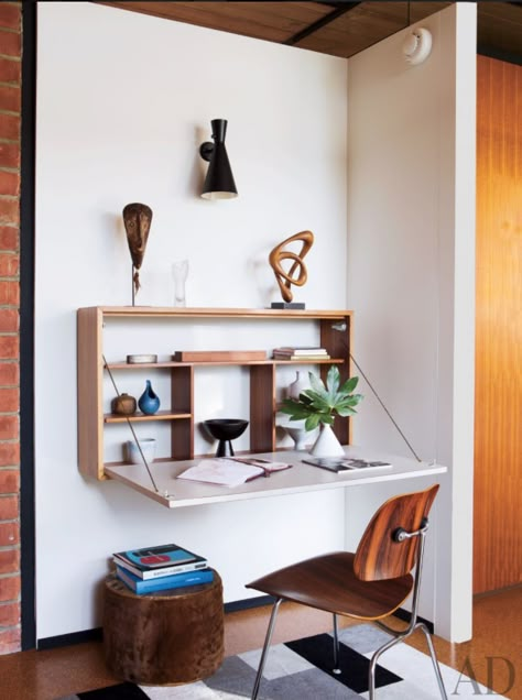 Finding room for a desk in your small space can be a challenge. And when you’re trying to get motivated to accomplish a task or two at home, the last thing you need is another obstacle. So if you’re low on square footage, a wall-mounted desk or built-in work surface can be a great space-saving solution, providing roughly the same work area with a smaller footprint. Whether you prefer a surface built into existing storage, a simple plank that drops down from a wall-mounted shelf, or a table th... Small Bedroom Desk, Fold Down Desk, Space Saving Desk, Small House Interior, Small House Interior Design, Wall Mounted Desk, Interior Design Per La Casa, Small Bedroom Designs, Bedroom Desk