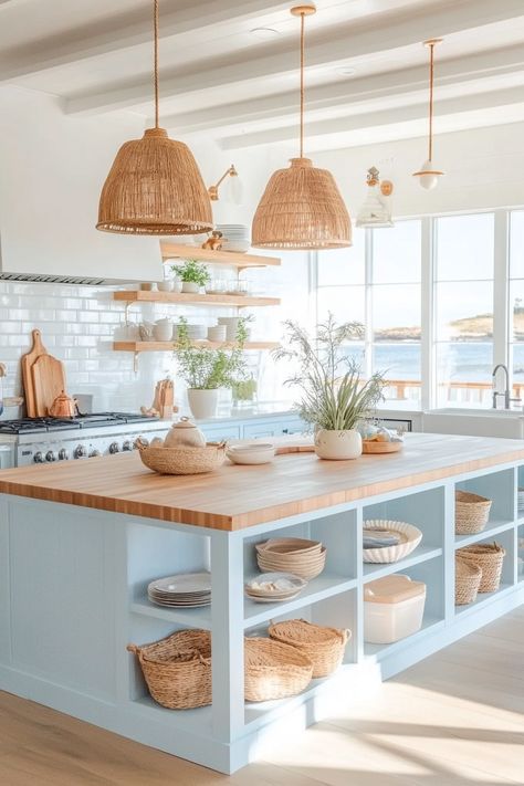 Discover the latest kitchen design with a serene coastal vibe! This bright and airy space features wicker accents, open shelving, and ocean views. Perfect for a refreshing and functional kitchen. #CoastalKitchen #InteriorDesign #LatestKitchenDesign Santorini Kitchen Design, Minimalist Beach House Kitchen, Beach Boho Kitchen, Small Beach Apartment Interior Design, Coastal Cowgirl Kitchen, Coastal Mediterranean Kitchen, Beach House Kitchen Design, Small Beach House Kitchen, Colorful Coastal Decor