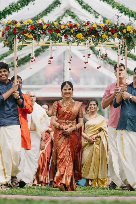 Simple south Indian bridal entry! We love a good bridal entry! It not only sets up the stage for a beautiful wedding day but also is a great way for the bridal reveal. This is one walk down the mandap or aisle that you will remember for a lifetime. So how do you make it one of a kind? We’ve done your homework for you and rounded up the most unique ideas that we loved for a bridal entry. Read on and bookmark your favourite one now! Unique Bridal Entry, Indian Bridal Entry, Bridal Entry Ideas, Indian Wedding Aesthetic, Indian Wedding Stage, Bridal Entry, Bride Entry, Indian Marriage, Wedding Background Decoration