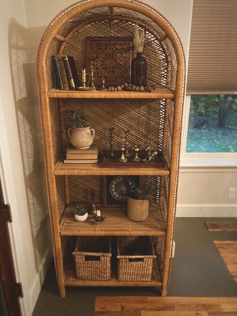 Wicker Book Shelf, Wicker Shelf Decor Ideas, Rattan Shelves Styling, Wicker Magazine Rack Repurposed, Rattan Book Shelf, Arched Wicker Shelf, Wicker Bookshelf Styling, Wicker Home Decor, Rattan Shelf Decor