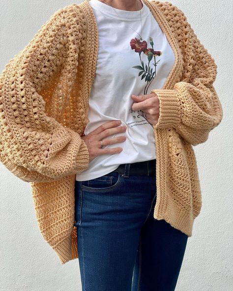 A woman wearing a hexagon crochet cardigan. Crochet Sweater Jacket Pattern Free, Solid Granny Hexagon Cardigan, Crochet Shawl Collar Sweater Pattern, Velvet Cardigan Crochet Pattern, Thick Crochet Cardigan, Puff Stitch Cardigan, Free Easy Crochet Cardigan Patterns For Women, Cardigans Crochet Patterns Free, Red Heart Super Saver Yarn Free Patterns Crochet