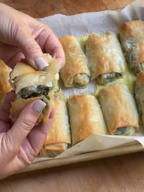 Spinach and feta roll being torn open hero image Feta Rolls, Turkish Borek, Borek Recipe, Phyllo Dough Recipes, Greek Spinach, Spinach Rolls, Phyllo Recipes, Greek Spinach Pie, Pastry Puff