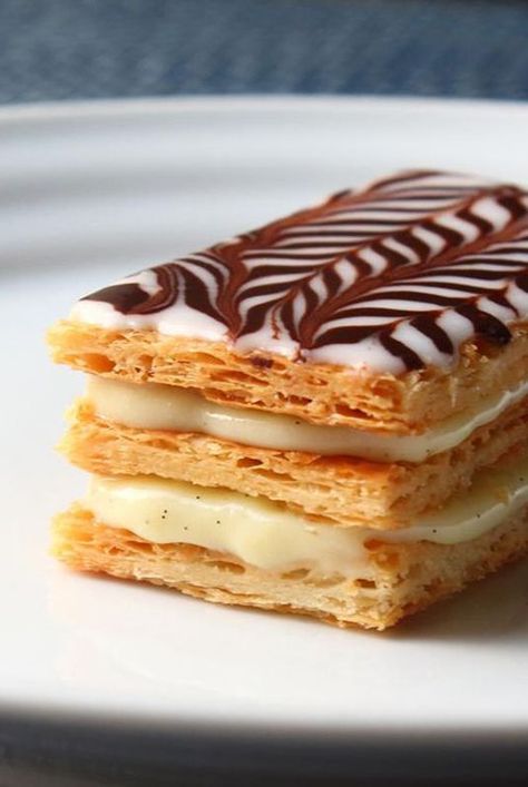 Make Napoleon dessert with Chef John's recipe that uses frozen puff pastry sheets baked perfectly crisp, light, and flaky for layering with cream. #dessertrecipes#dessertideas#dessertdishes#dessertinspiration#sweettreats#bars#dessertbars#barrecipes Napoleon Pastry, Napoleon Dessert, Easy Puff Pastry Desserts, Brunch Pastries, Chef John Recipes, Napoleon Cake, Classic French Desserts, Puff Pastry Desserts, Easy Puff Pastry