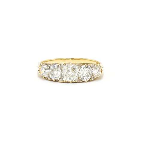 A graduated band is set with five old mine diamonds totaling approximately 2.50 carats accented with rose cut diamonds totaling approximately 0.10 carat mounted in 18 karat yellow gold. Circa 1890s. 4 Stone Engagement Rings, Four Stone Diamond Ring, 2024 Engagement Rings, 5 Stone Engagement Ring, Five Stone Engagement Ring, Brown Diamond Engagement Ring, Edwardian Diamond Ring, European Cut Diamond Ring, Fred Leighton