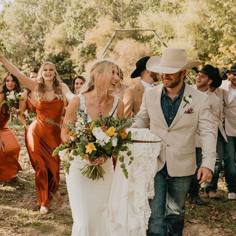 Western Wedding Magazine on Instagram: “Scroll to the right to see some epic wedding fun✨ From the detail, the color pallet, the unity, her dress + her bridesmaids, the dummy…” Terracotta Western Wedding Groomsmen, Tan Wedding Suits Western, Tan Groomsmen Jackets With Jeans, Western Wedding Bridal Party, Western Wedding Party Attire, Country Wedding Groomsmen Attire, Western Wedding Groomsmen Attire, Cowboy Groom Attire, Western Groomsmen Attire