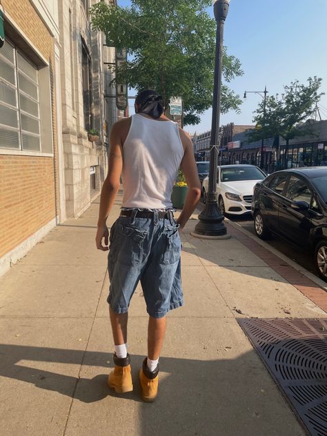 Timberland Boots Outfit Jorts, Timbs Outfit Men Summer, Shorts And Boots Men, Timberland Summer Outfits, Timb Boots Outfit, Mens Wife Beater Outfit, White Beater Outfit, White Timberlands Outfit, Timberland Boots Outfit Summer