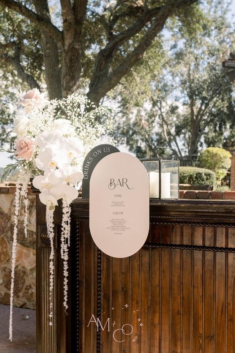 Pearl Wedding Signage, Hanging Bar Sign Wedding, Bar Wedding Flowers, Drink Wall Wedding, Wedding Color Palette Black, Wedding Bar Flowers, Bar Signs For Wedding, Diy Wedding Bar Sign, Bar Ideas Outdoor