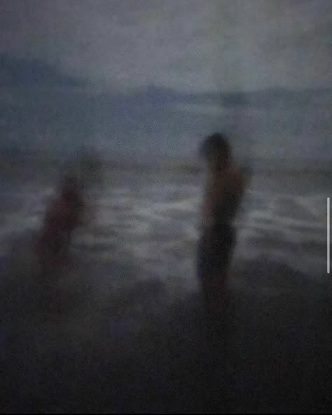 A blurry image of a young couple night swimming on a black sand beach in Ecuador. The grainy aesthetic makes the image look vintage. Grunge Beach Pics, Travel Dark Aesthetic, Dark Lake Aesthetic, Night Blurry Aesthetic, Night Swimming Aesthetic, Dark Beach Aesthetic, Chris Manawa, Beach Night Aesthetic, Beaches At Night