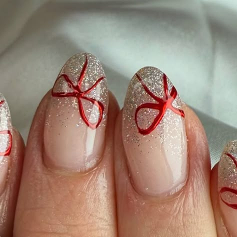 Carys barnes on Instagram: "🎀 help me tie a bow 

Shona let me decide today what was putting on so thought these was very pretty to recreate. They was inspired by @nailsbyheather.errington 

Products used: 
@nailstampingqueenuk  red chrome 
@dali.artistic  white glitter gel polish 

#nails #christmasnails #bownails #festivenails #nailsofinstagram #nailsonfleek" Red With White Chrome Nails, Glitter Bow Nails, Christmas Bow Nail Designs, Red Chrome Nails With Bow, Christmas Nails Sparkly Red, Gel Ex Nails, White Glitter Gel Polish, Red Bow Nails, Christmas Nails Chrome