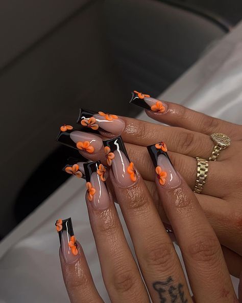 #blacknails #nailart #nailtech #orange #flowers #nailsart #orchids #naildesign #summernails #fashion #style #summervibes #inspo Orange Nail Designs Fall Autumn, Fall Nail Short Square, Black Tip Nails With Flowers, Nail Ideas Orange And Black, Simple Baddie Nails Almond, Halloween Color Nails Acrylic, French Tip With Acrylic Flowers, Black N Orange Nails, Fall 2024 Acrylic Nails