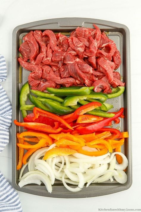 Fajitas are one of my favorite meals and are sure to become yours with this recipe. This Sheet Pan Steak Fajitas recipe is so good and will feed your whole family. With a few simple ingredients, you will have a delicious meal ready to serve in no time. Sheet Pan Flank Steak Fajitas, Sheetpan Fajitas Beef, Beef Fajitas In The Oven, Sheet Pan Beef Fajitas, Fajitas Beef, Sheet Pan Beef, Fajitas Steak, Sheet Pan Steak Fajitas, Kielbasa Cabbage