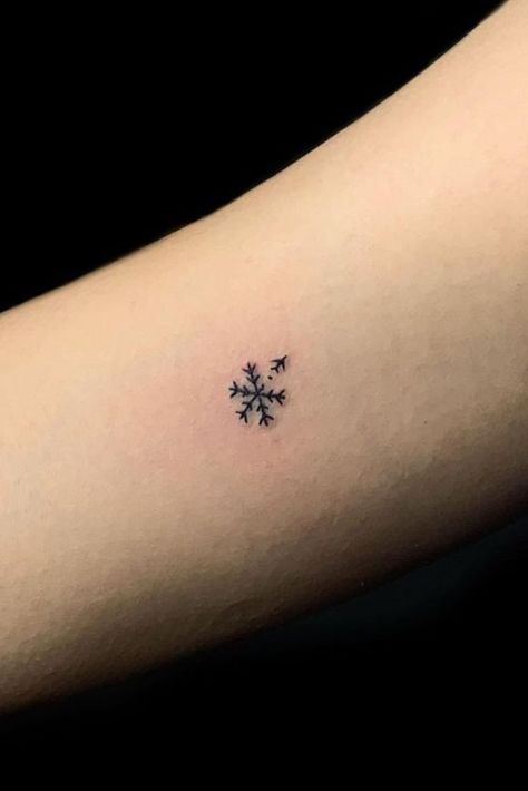 25 Snowflake Tattoo Ideas: Channeling the Beauty of Winter's Delicacy Minimalist Snowflake Tattoo, Winter Tattoos For Women, Snow Flakes Tattoo, Enjoy The Journey Tattoo, Small Christmas Tattoos, Snowflake Tattoo Design, Snowflakes Tattoo, Winter Tattoo Ideas, Snow Tattoo Ideas