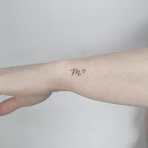 Fine Line Name Tattoo Wrist, Fine Line Tattoo For Son, Cursive M Tattoo, Fine Line Initial Tattoo, Fineline Word Tattoo, Fine Line Name Tattoo, Letter M Tattoo, Cute Initial Tattoos, Letter M Tattoos