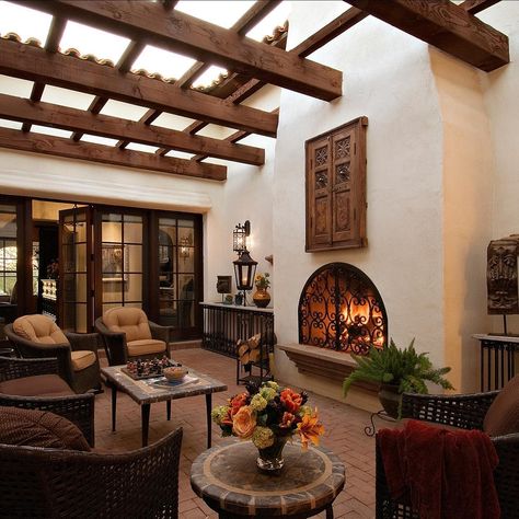 Higgins Architects | Our Spanish Colonial home on Valley Vista has this wonderful interior courtyard with a fireplace & trellis. Natural light is brought into… | Instagram Spanish Hacienda Interior Design, Spanish Colonial Patio, Spanish Style Sunroom, Spain Style Home, Spanish Style Homes Interior Decor Living Room, Spanish Ranch Style Homes Interior, Small Spanish Style Homes Interior Decor, Spanish Hacienda Interior, Spanish Western Home