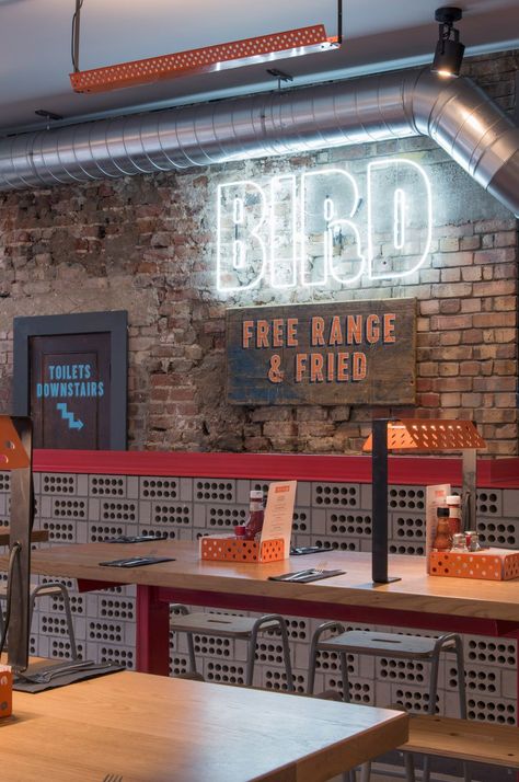 Brinkworth strips back London pub for fried chicken restaurant Industrial Restaurant Interior, Grey Interior Paint, Wings Restaurant, Fried Chicken Restaurant, Chicken Restaurant, Village Market, Chicken Shop, Glazed Brick, Industrial Restaurant