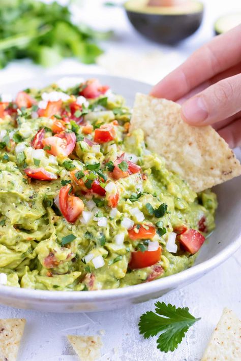 This Homemade Guacamole recipe is the absolute BEST healthy dip and is our go-to party snack or Cinco de Mayo appetizer.  Learn how simple it is to make guacamole with ripened avocados and a few other easy-to-find ingredients! #evolvingtable #easy #guacamole #recipe #cincodemayo #dip Guacamole Recipe Easy Homemade, Guacamole Recipes, Homemade Guacamole Recipe, Avocado Salsa Recipe, Healthy Dip, Guacamole Recipe Easy, Guacamole Dip, Best Guacamole Recipe, Easy Guacamole