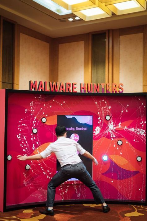 TRINAX | Malware Hunters Bishi Bashi Arcade Game Interactive Booth Games, Interactive Games For Events, Game Booth Design, Interactive Booth Ideas, Interactive Event Ideas, Activation Games, Gamification Ideas, Games For Events, Interactive Booth