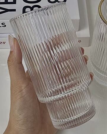 Someone holding a ribbed glass for cocktails or water. Amazon Glass Cups, Ribbed Glass Cups, Plastic Glasses Drinking, Ribbed Drinking Glasses, Trendy Glass Cups, Aesthetic Drinking Glasses, Cute Drinking Glasses, Ridged Glassware, Aesthetic Glass Cups