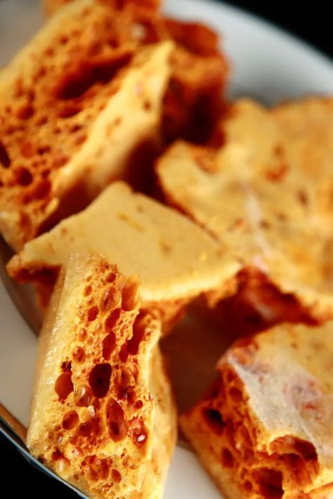 Close up view of a plate of golden sponge toffee chunks. Sponge Toffee Recipe, Sponge Toffee, Sponge Candy, Honeycomb Candy, Toffee Recipe, Candy Recipes Homemade, Peanut Brittle, Candy Making, Baking Ideas