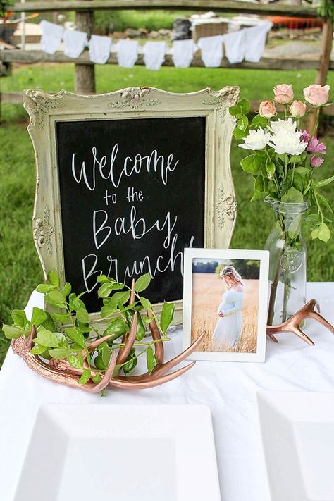 Our Frame #16 with custom hand-lettering accented by our Rose Gold Antlers creates a lovely welcome table for this surprise baby brunch! Welcome Table Baby Shower Ideas, Baby Shower Entrance Table, Baby Shower Welcome Table, Tea Party Baby Shower Theme, Baby Shower Greetings, Baby Lunch, Baby Brunch, Baby Table, Storybook Baby Shower