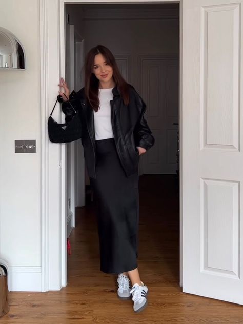 Chill But Classy Outfits, Black Satin Skirt Winter, Black Silk Slip Skirt Outfit, Silk Midi Skirt Outfit Fall, Long Black Skirt Outfits For Winter, Black Silk Skirt Outfit Fall, Adidas Samba Dress Outfit, Satin Skirt Black Outfit, Sambas Adidas Women Outfit Skirt