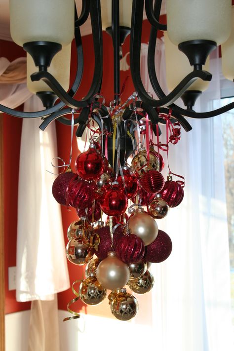 Christmas decorations-bulbs from chandelier Christmas Decor Ideas For Chandelier, Decorating A Chandelier For Christmas, Christmas Chandelier Decorations, Chandelier Christmas Decor, Chandelier Ornaments, Make A Chandelier, Christmas Chandeliers, Christmas Chandelier Decor, Chandelier Decorations