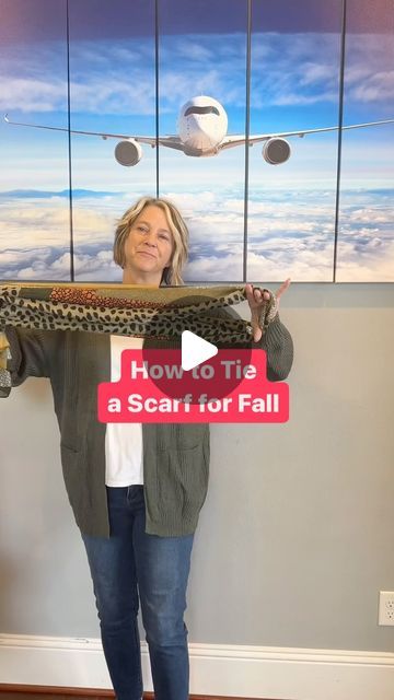 Travel Tips Pilot Wife on Instagram: "✈️ How to Tie a Scarf for Your Travel Outfit 🍁 Type FALL for all details.
Fold scarf in half.
Lay it against the back of your neck with one hand holding the bent end open.
Thread one end through that bend.
Twist that hole and stick the other end of the scarf through that end for a cascading outfit look.
Find 11 other ways to tie a scarf on my YTube channel. Search that title plus my channel name (Travel Tips by Laurie)
👨🏼‍✈️ I’m a Houston pilot wife sharing tips to help you “travel the globe without a worry in the world” on YTube and IG. #falloutfit #traveloutfit #howtotieascarf #fallscarf #midlifestyle" How To Wear An Infinity Scarf Tutorials, Wrap A Scarf Around Neck, How To Wrap A Scarf Around Neck, Tying Scarfs How To Neck Scarves, Tie Scarf How To Neck Scarves, Large Scarf Tying Ideas, How To Tie A Scarf Around Your Neck, Fold Scarf, Swimsuit Coverup Ideas