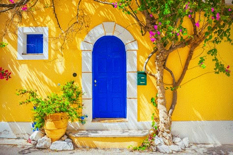 Colors that compliment Yellow - Mustard Yellow House with Blue Door Yellow House Exterior, Stucco Siding, Mediterranean Homes Exterior, Old Wooden Doors, Yellow House, Roof Colors, Yellow Houses, Front Door Colors, House Color