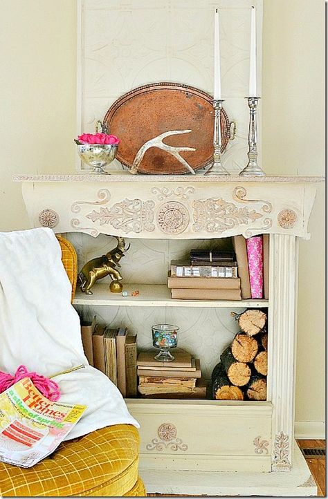 DIY It: Bookshelf turned fireplace -- made from a bookcase, an old mirror frame & an old footboard Faux Foyer, Used Kitchen Cabinets, Revolving Bookcase, Fake Fireplace, Old Bookcase, Bookcase Diy, Bookcase Door, Pallet House, Bookcase Headboard