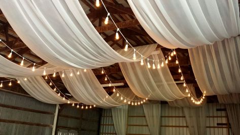 Ceiling draping in a barn. This makes a ... Ceiling Draping Wedding, Reception Ceiling, Wedding Ceiling Decorations, Diy Drapes, Ceiling Drapery, Wedding Drapery, Wedding Draping, Draping Wedding, Wedding Ceiling