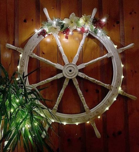 A great nautical Christmas wreath idea using a ship wheel. Featured on Completely Coastal with many other inspirational ship wheel decor ideas for the wall. Wheel Christmas Wreath, Florida Christmas Decorations, Seaside Garden Ideas, Ship Wheel Decor, Nautical Christmas Decor, Wheel Wall Decor, Boat House Ideas, Christmas Wall Decor Diy, Captains Wheel