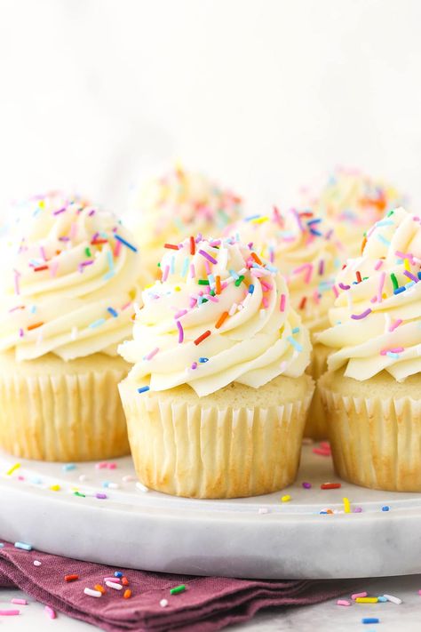 These Vanilla Cupcakes are moist, light & fluffy! If you are looking for a totally foolproof, easy & perfect classic vanilla cupcake recipe this is it! #cupcakes #vanilla #frosting Vanilla Cupcake Design, Vanilla Cupcake Frosting, White Cupcake Recipe, Cupcake Frosting Recipe, Vanilla Frosting For Cupcakes, Homemade Vanilla Frosting, White Cupcake Recipes, Best Vanilla Cupcake Recipe, Fluffy Vanilla Cupcakes