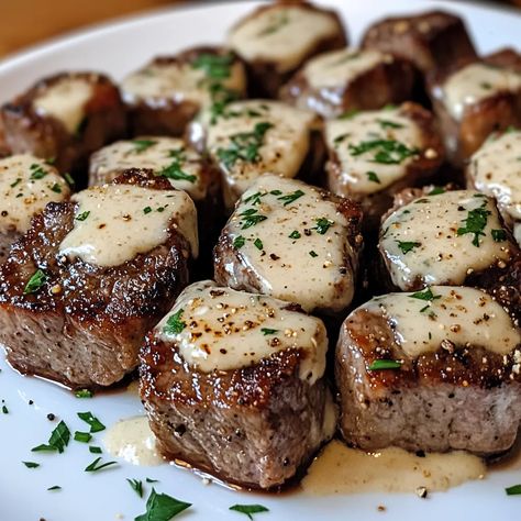 Garlic Butter Steak Bites with Parmesan Cream Sauce Recipe Garlic Butter Steak Bites With Parmesan Cheese Sauce, Carnivore Steak Bites, Filet Mignon Steak Bites, Garlic Parm Steak Bites, Garlic Butter Steak Bites With Parmesan, Garlic Parmesan Steak Bites, Tenderized Steak Recipes, Parmesan Steak Bites, Steak Entrees