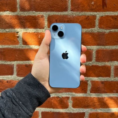 holding blue iphone 14 in front of brick wall Iphone 13 Blue Aesthetic, Iphone 13 Blue, Mad Tsai, Iphone Case Elegant, I Phone 13, Iphone Charger Cord, Iphone Blue, Apple Iphone Accessories, Blue Iphone Case