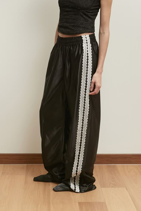 Designer fashion, Seoul-fully created | W Concept Spiked Pants, Track Pants With Heels, Lace Pants Outfit, Gym Party, Karate Pants, Sporty Pants, Ripstop Pants, Lace Tape, Lace Pants