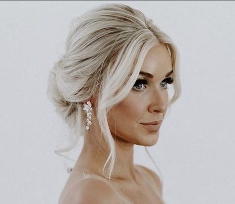 Low Updo Wedding Hair Blonde, Wedding Hair Messy Low Bun, Middle Part Low Bun Wedding, Bride Blonde Hairstyles, Veil In Updo, Wedding Simple Updo Brides, Timeless Wedding Hair Up Dos, Low Messy Bun Wedding Hair With Veil, Boho Bride Makeup Blonde