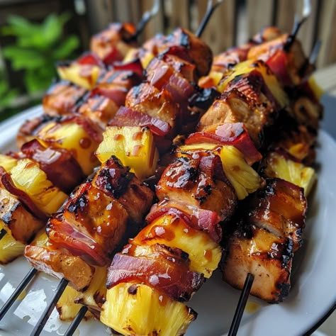 🍍 Tropical on a stick: Hawaiian Chicken Bacon Pineapple Kebabs! #TropicalTaste Hawaiian Chicken Bacon Pineapple Kebabs Ingredients: Chicken breasts, cubed Bacon slices Pineapple chunks BBQ sauce Instructions: Wrap chicken in bacon, thread on skewers with pineapple. Grill, basting with BBQ sauce. ���🍢🥓 Experience the flavors of Hawaii with every bite. Perfect for your next BBQ! Ignite your grill and share with #KebabKraze! Hawaiian Orderves, Steak And Pineapple Recipes, Chicken Kebabs On The Grill, Pitboss Recipes, Pineapple Grill, Bacon Sticks, Hawaiian Chicken Skewers, Chicken Skewers Grilled, Hawaii Bbq