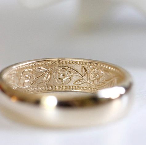 This 14k yellow gold ring is 6mm wide and domed on the outside. It features my petunia pattern on the inside. The five-petaled flowers and their leafy vine weave their way around the band. This is a great traditional band on the outside made to match a companion ring with the same pattern outside.  It's a great ring for everyday wear. A wonderful, heirloom-quality wedding band that can one day be passed down to the next generation. Also available in 14k rose gold and 14k white gold. Please note, Ring With Flowers, Floral Wedding Band, Flower Wedding Band, Romantic Wedding Rings, Non Traditional Wedding Ring, Traditional Wedding Rings, Traditional Wedding Bands, Floral Wedding Ring, Floral Wedding Bands