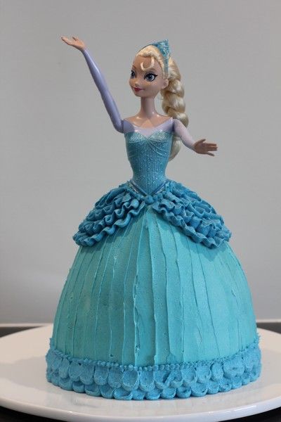 Elsa Cake (Buttercream tutorial) and an Ice-themed Birthday Party « Leave Room for Dessert Frozen Elsa Doll Cake, Doll Cake Tutorial, Frozen Doll Cake, Elsa Doll Cake, Elsa Torte, Frozen Elsa Doll, Elsa Cake, Elsa Cakes, Barbie Doll Cakes