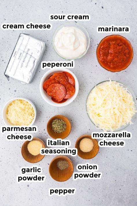 Change up your snack game with Pepperoni Dip! Cream cheese and mozzarella cheese makes it creamy and gooey, and this easy recipe makes it a breeze to prepare. Whether it's game day, a family party, movie night, or just a fun snack night, this pepperoni pizza dip will steal the show! Cream Cheese Pizza Topping, Easy Pizza Dip Recipe, Pepperoni Dip Cream Cheese, Pepperoni Dinner Ideas, Crockpot Pizza Dip With Cream Cheese, Pizza Cheese Ball, Mdw Food, Pepperoni Cheese Dip, Cream Cheese Pizza Dip