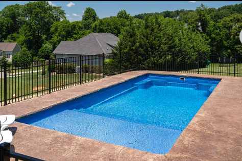 A simple budget-friendly inground fiberglass pool installation with great features including a tanning ledge, stairs, and seating in the deep end. Shallow Inground Pool, Inground Pool Ideas Simple, In Ground Pool With Tanning Ledge, Simple In Ground Pool Ideas, Inground Pool Tanning Ledge, Simple Pool Ideas Inground, 16x36 Inground Pool, In Ground Rectangle Pools, Inground Pool Ideas With Tanning Ledge