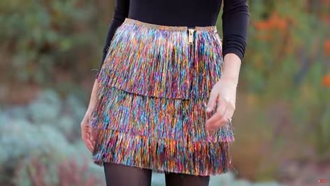 This is a guide to making a DIY tinsel skirt. Learn how to make a multi-layered Christmas tinsel skirt, plus tinsel-fringe pants, with this fun step-by-step tutorial. Tinsel Skirt Outfit, Diy Tinsel Skirt, Tinsel Dress Diy, Diy Tinsel Jacket, Fringe Skirt Diy, Tinsel Skirt, Diy Tinsel, Diy Cardigan, Forest Festival